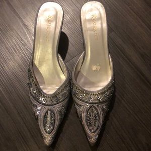 Heels (Slight worn spot in the m. of left shoe!)